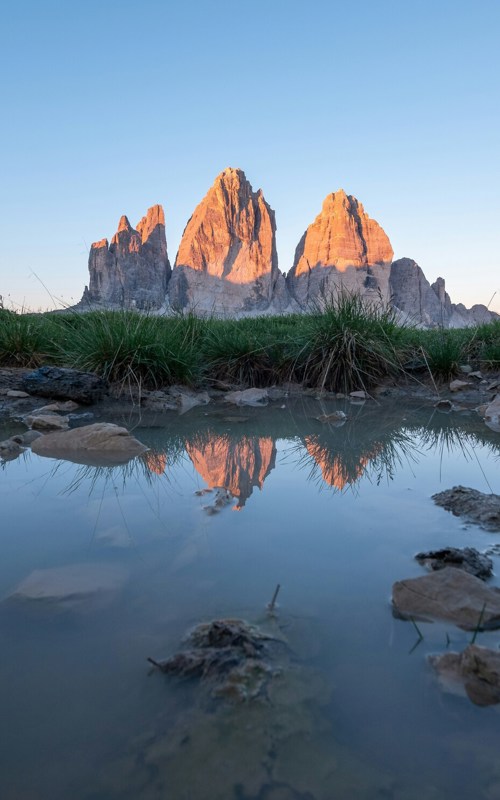 Mountains reflected in the water in the morning