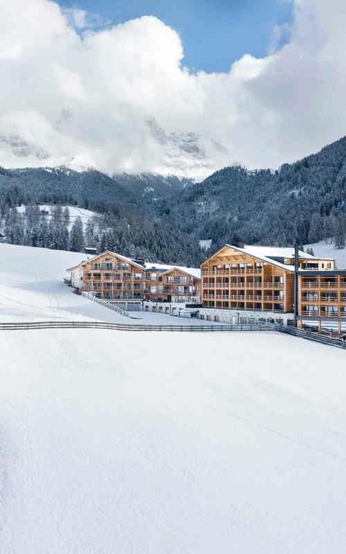 Wooden house in a snow-covered landscape in the mountains