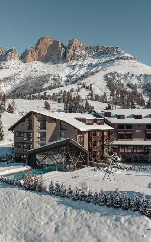 Modern hotel with pool & garden in the snow-covered Alps