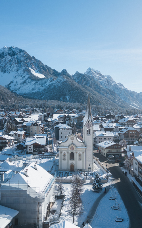 San Vigilio di Marebbe parish church & village centre in winter